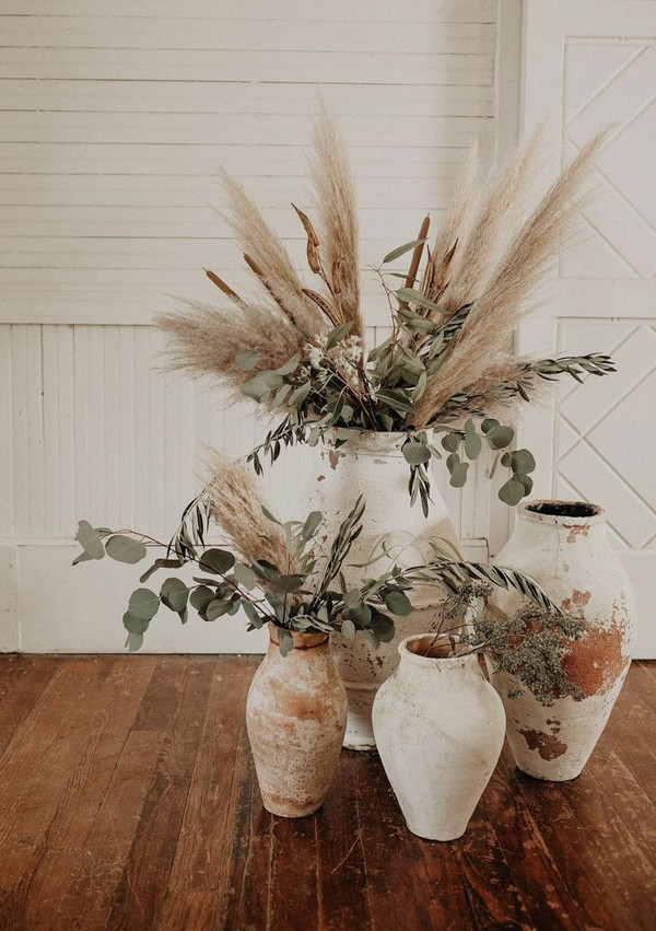 Clay pottery and pampas grass for bohemian wedding decor