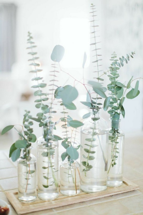 Minimalist eucalyptus and bottles wedding decor