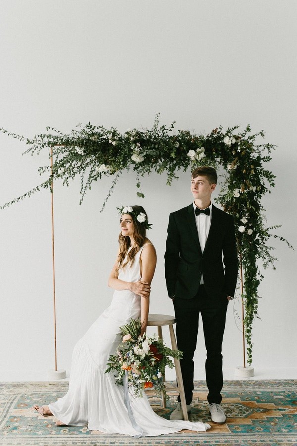 Minimalist greenery indoor wedding arch