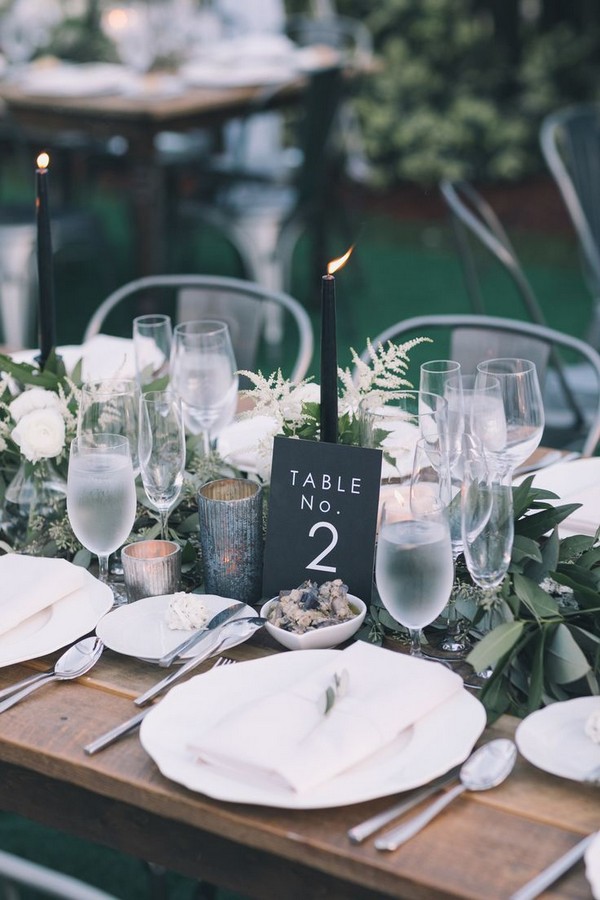 Natural greenery wedding centerpiece with black table number
