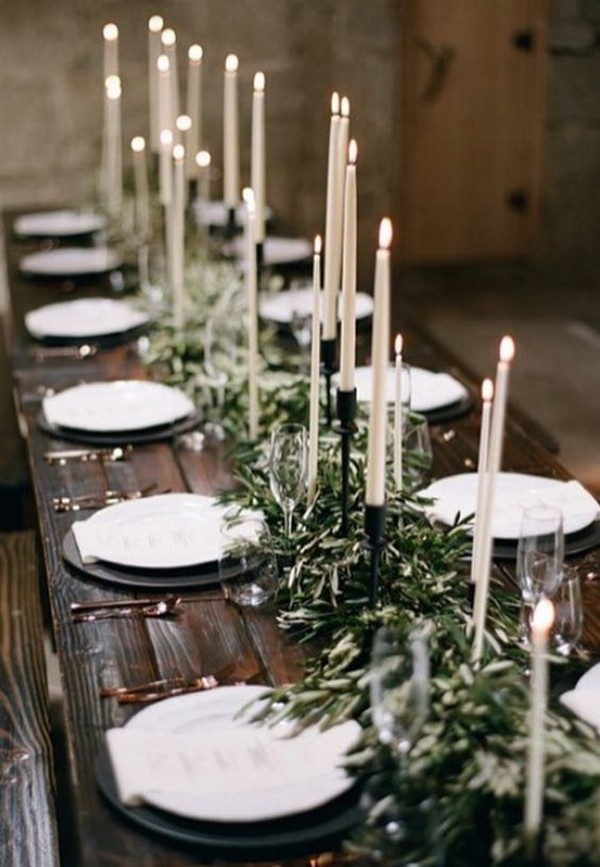 Rustic boho chic greenery wedding reception centerpiece with black and white candles