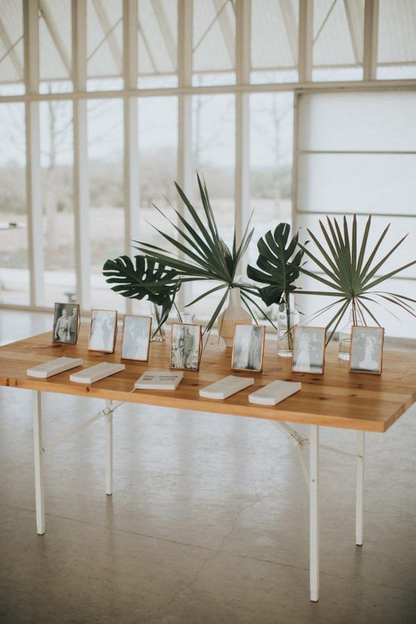 Sentimental framed photos and tropical greens shined at this minimalistic reception