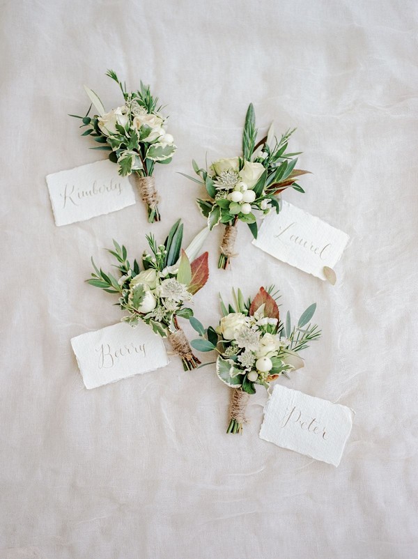 White rose bud and ivy button holes