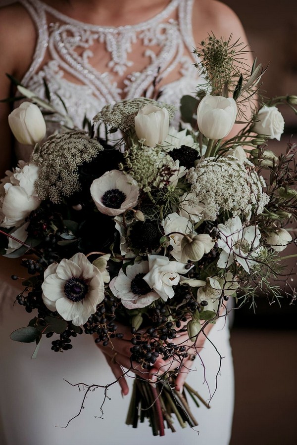 Wild bohemian bouquet featuring white hellebores, black roses, tulips, peonies and Queen Anne's lace
