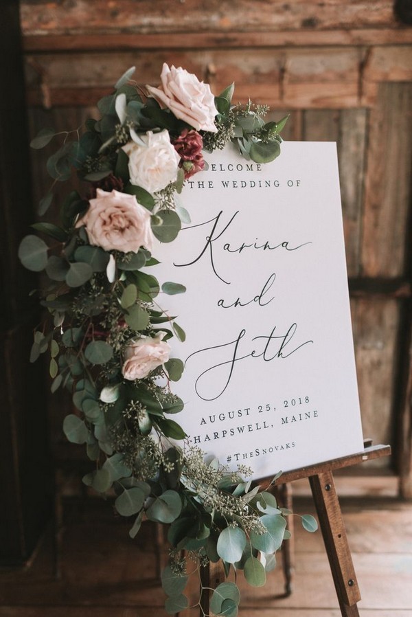blush and greeenry wedding welcome sign decorated with floral