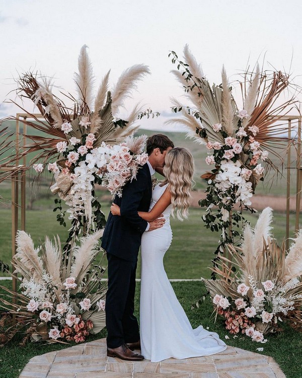 bobo roses, pampas grass and tropical preserved leaves wedding arch