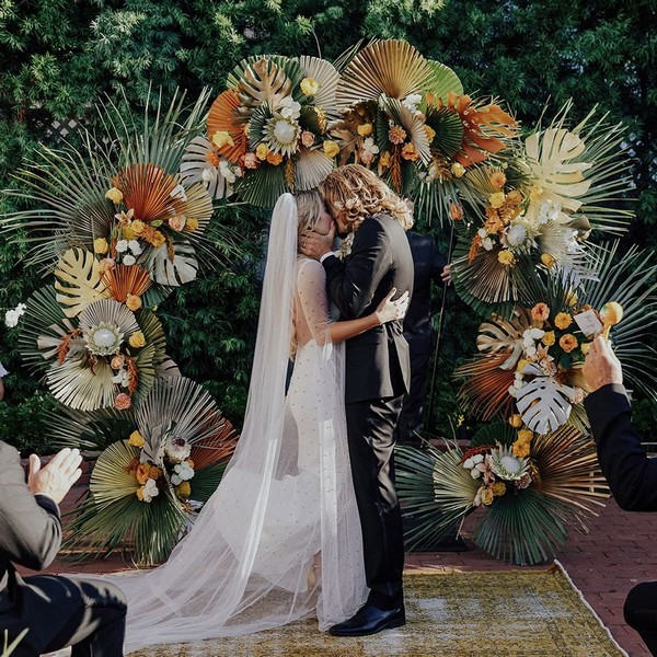 boho mixed palm leaves wedding backdrop