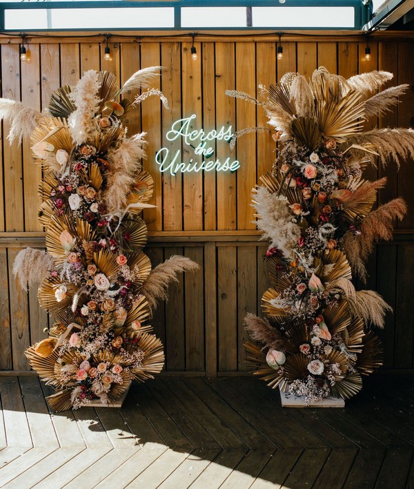 dried floral and pampas grass pillars wedding backdrop