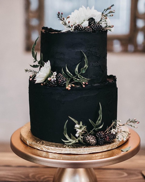 elegant black wedding cake with white flowers