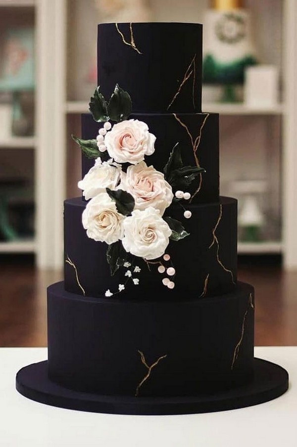 elegant black wedding cake with white sugar flowers