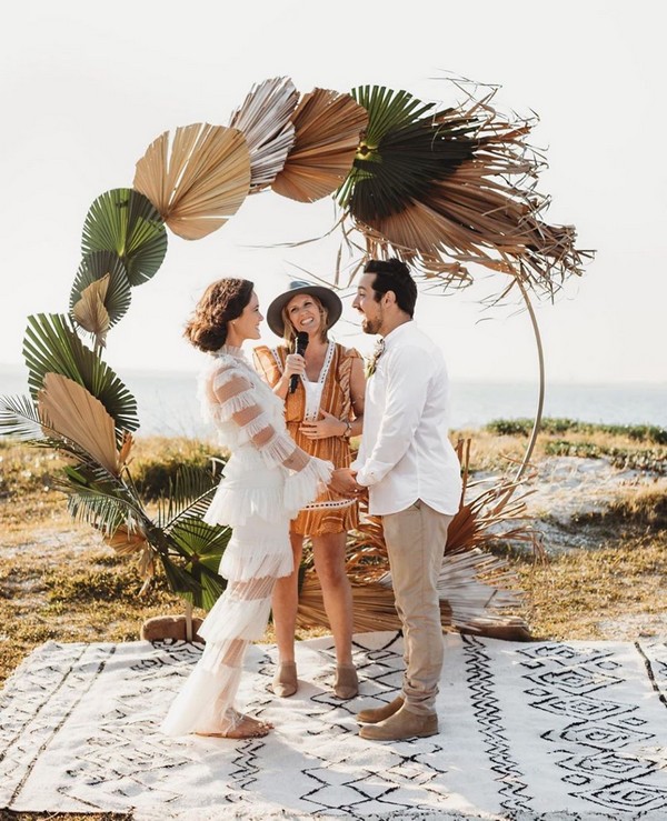 floral installation with fresh and dried palm leaves