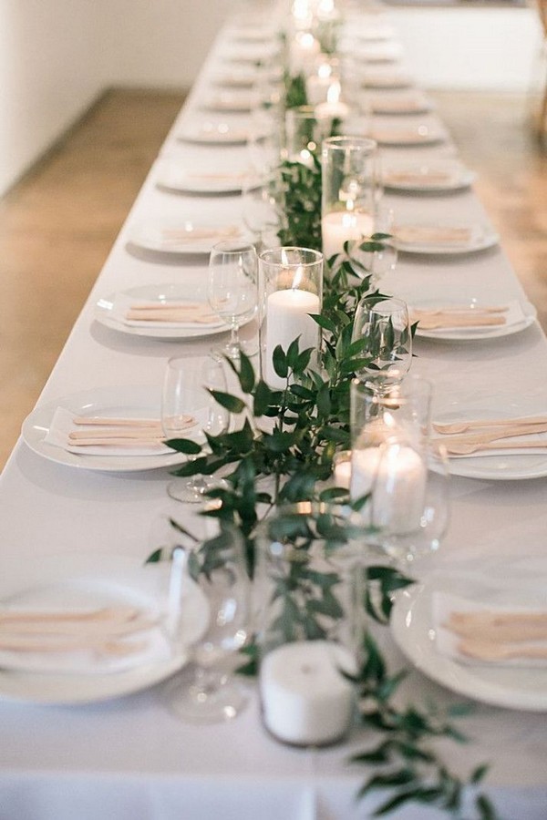 minimal garland with candle centerpiece wedding all white feasting table head table