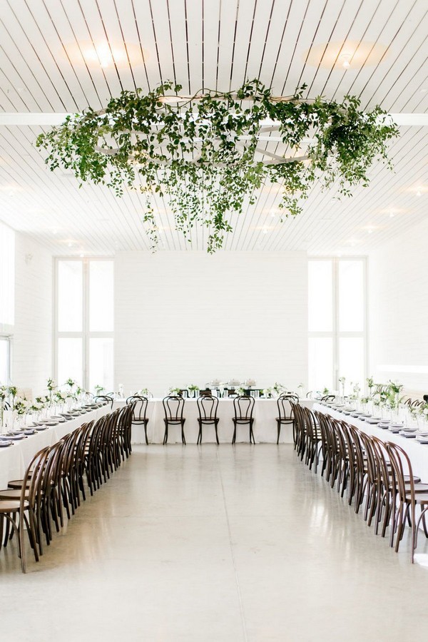 modern white rustic backdrop with lush greenery