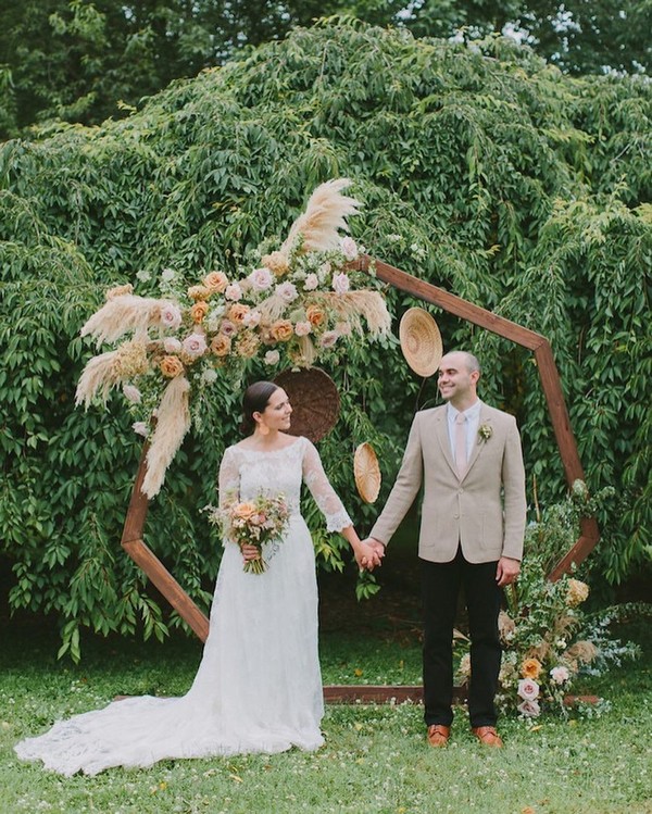 pampas floral arrangements heptagon wedding backdrop