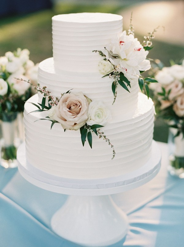 rustic buttercream wedding cake with pink roses