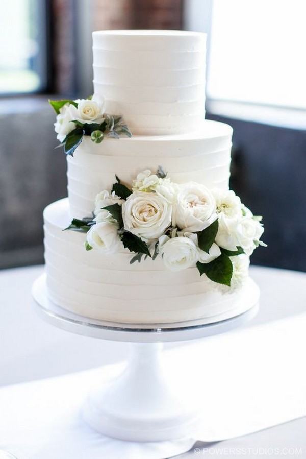 rustic buttercream wedding cake with white roses