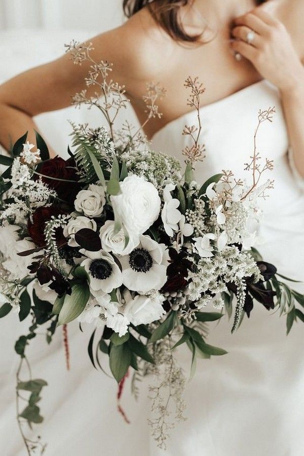 white and greenery wedding bouquet with black