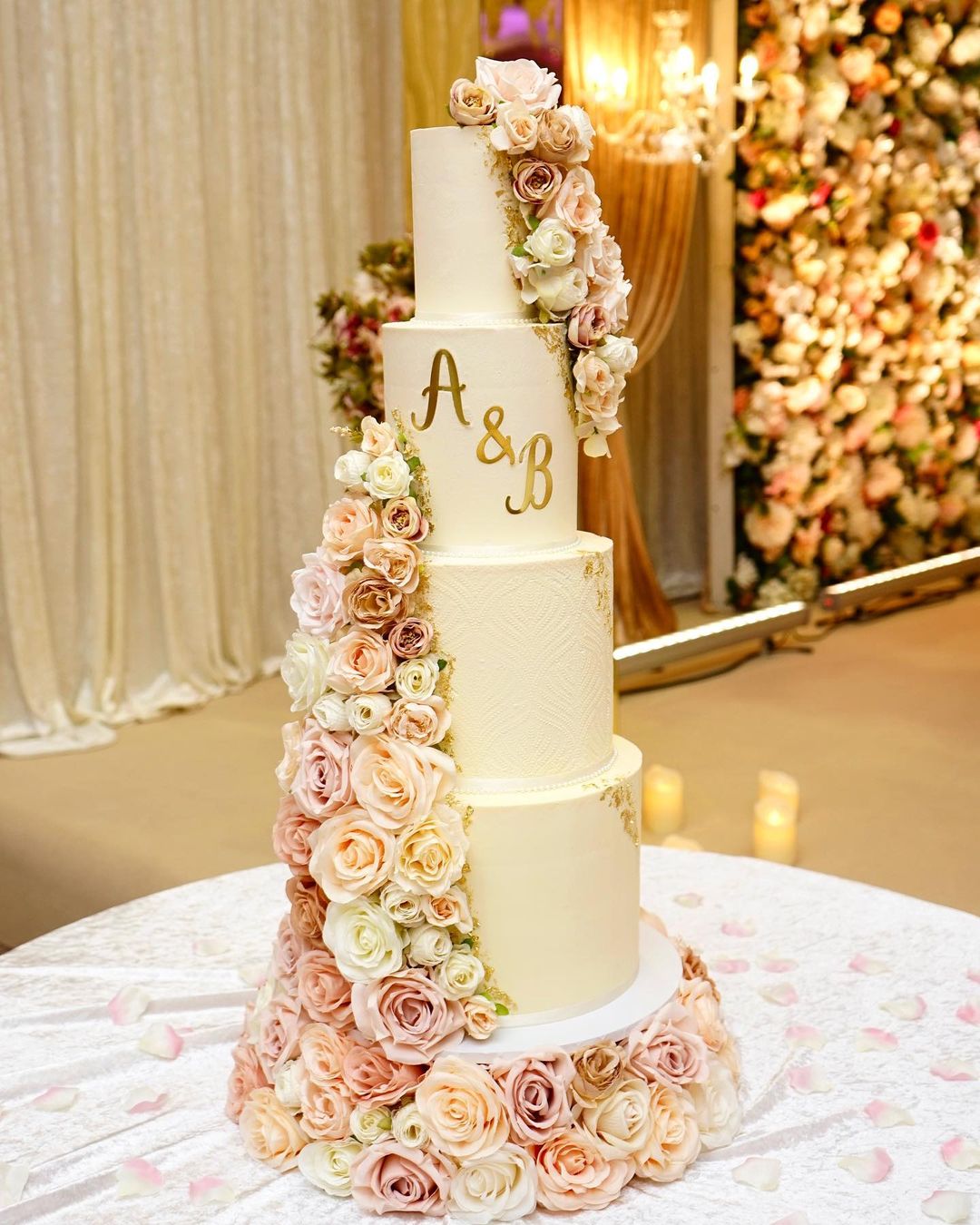 4 tier big wedding cake with pink roses via cakesbyromana