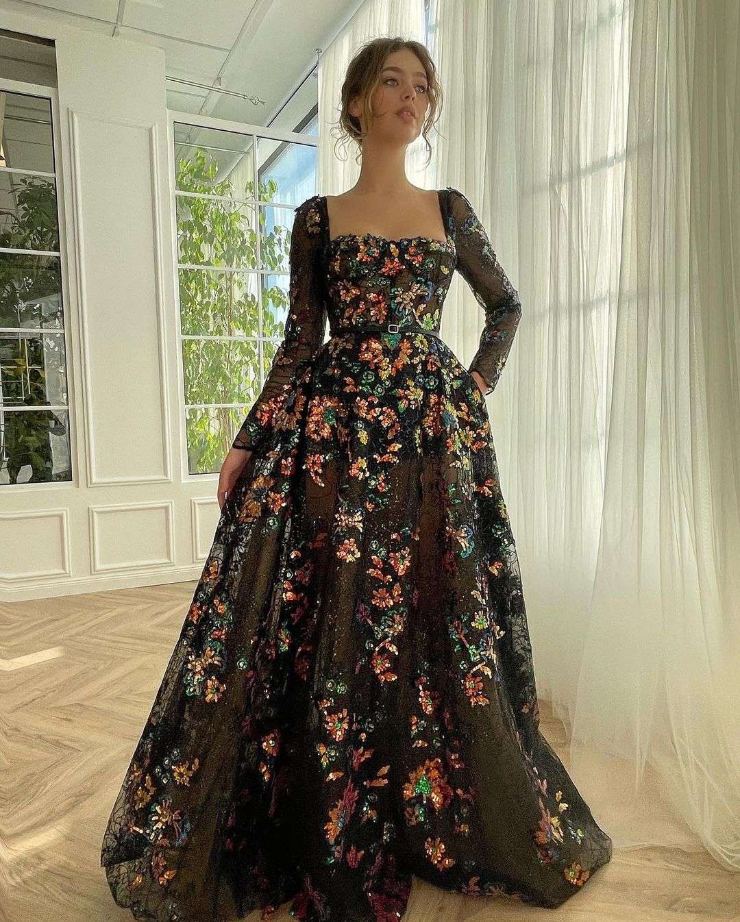 black wedding dress with floral and long sleeves