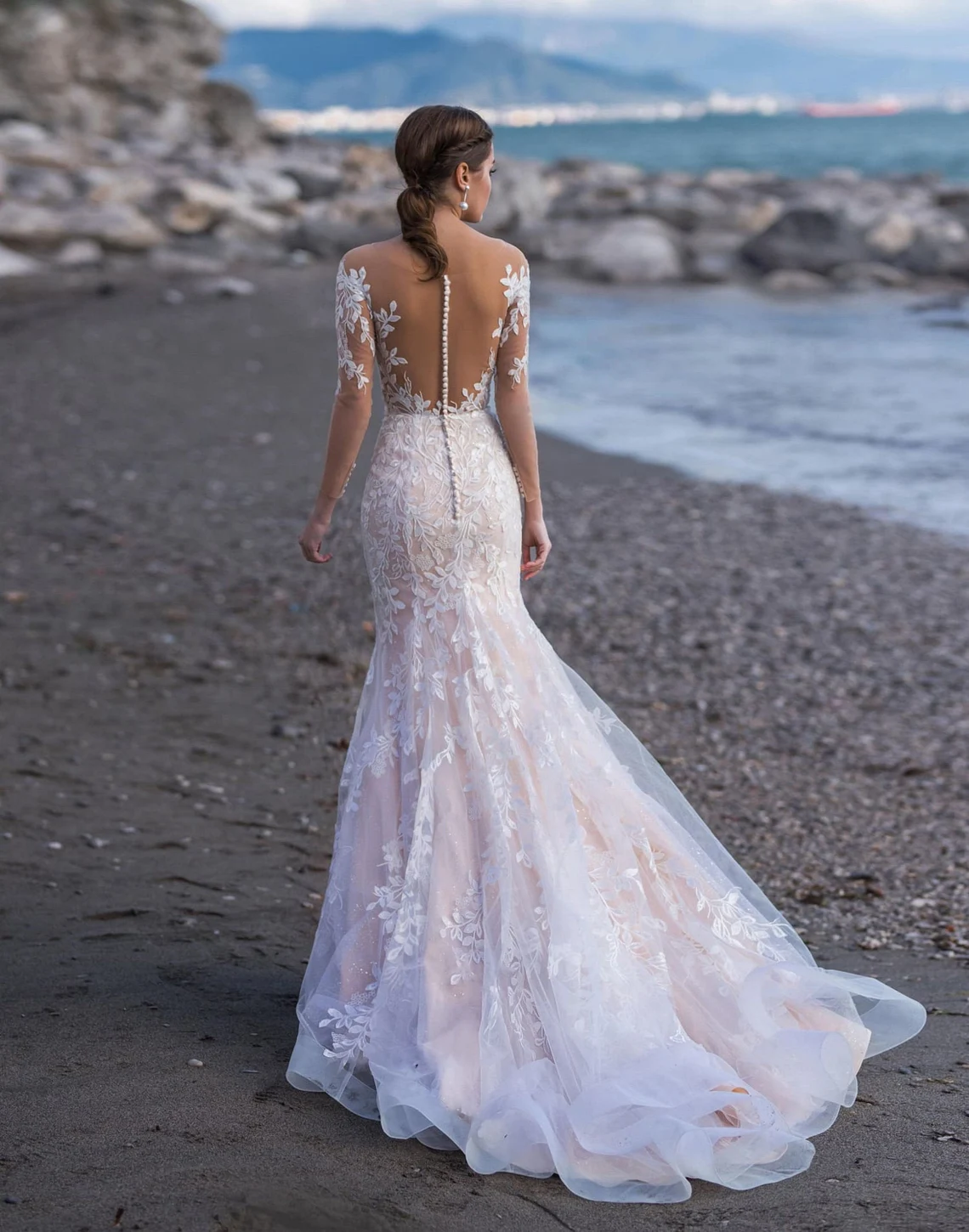 Mermaid wedding dress with glamorous sheer back. Off the image 1