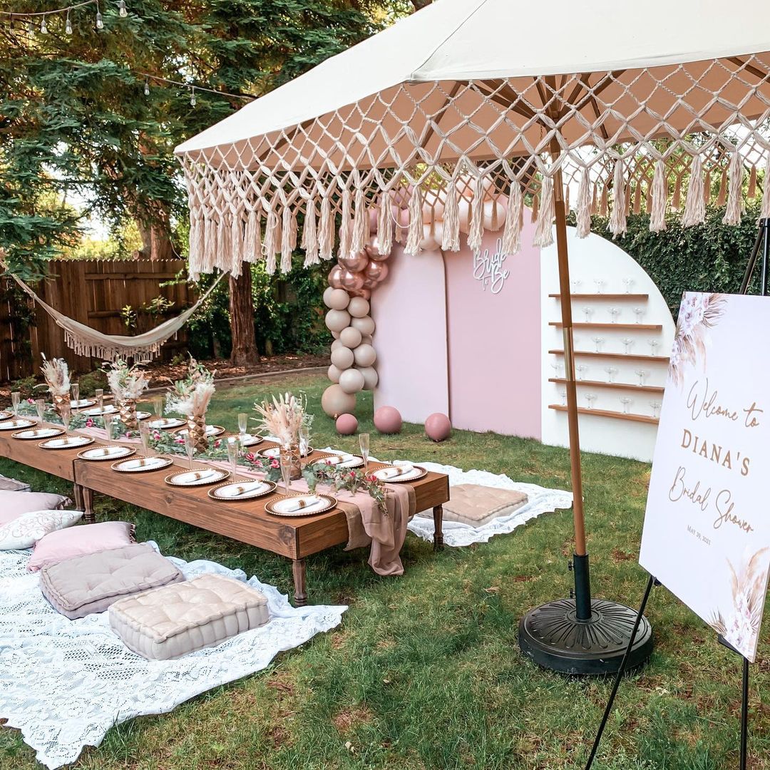 bridal shower theme ideas backyard bohemian pink picnic table setting