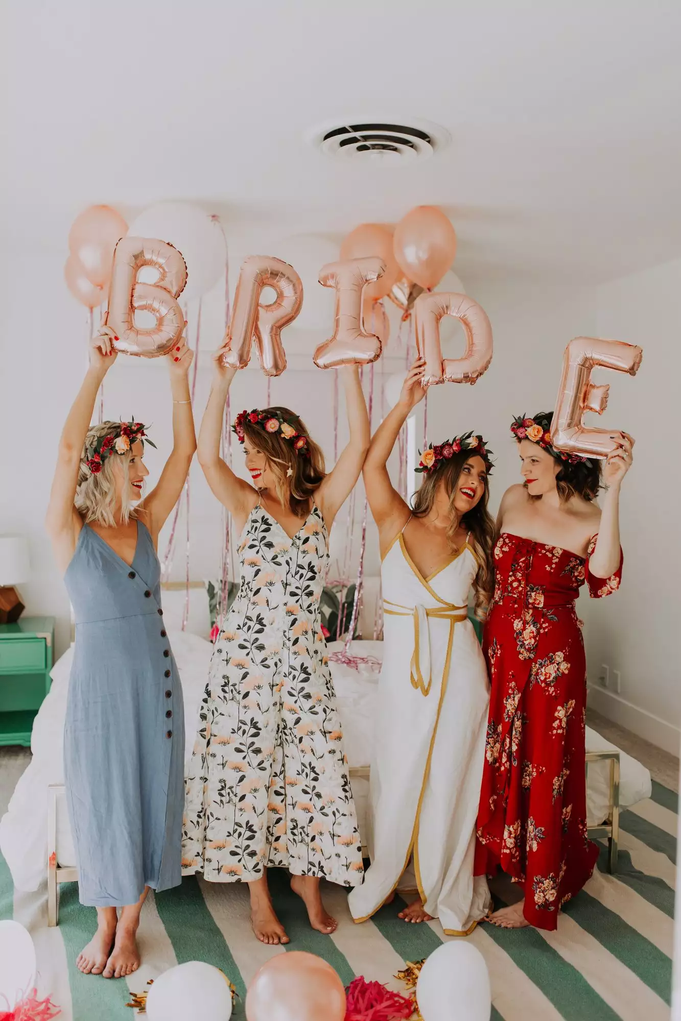 bridal shower guests holding up bride balloons