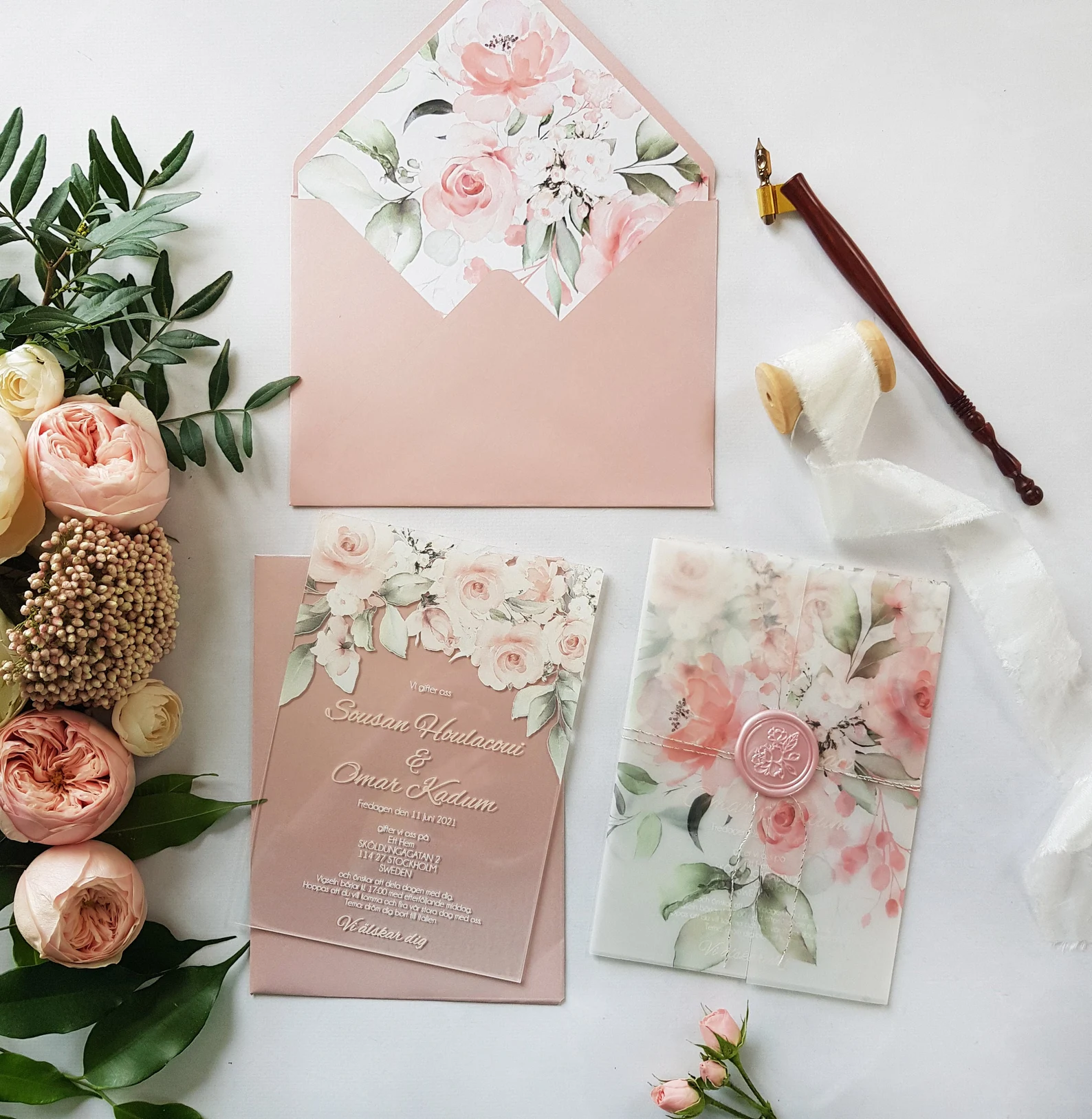 Blush floral acrylic invitation with vellum wrap and wax seal