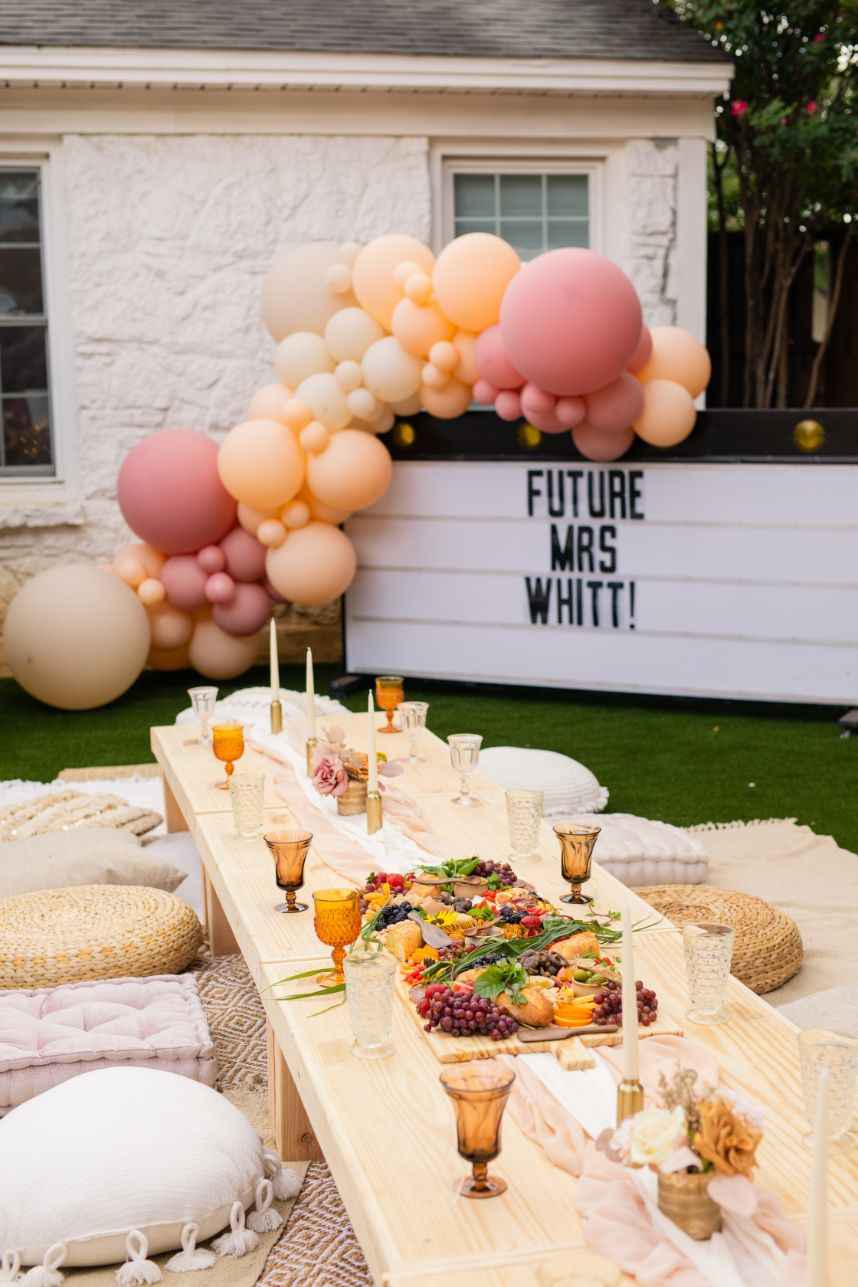 bridal shower ideas backyard brunch with peach and dusty rose balloons