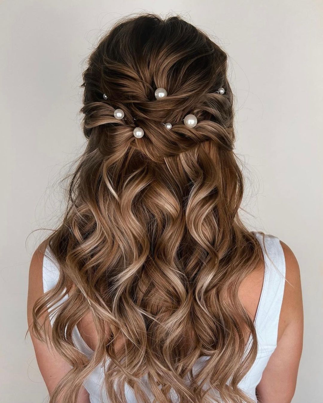 half up half down bridesmaid hairstyle with pearls