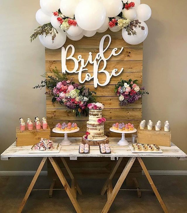 rustic bridal shower theme ideas wooden cake display with white balloons