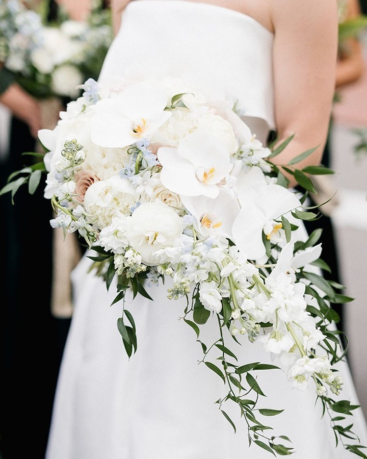 Bridal bouquet with white orchids, roses and greenery