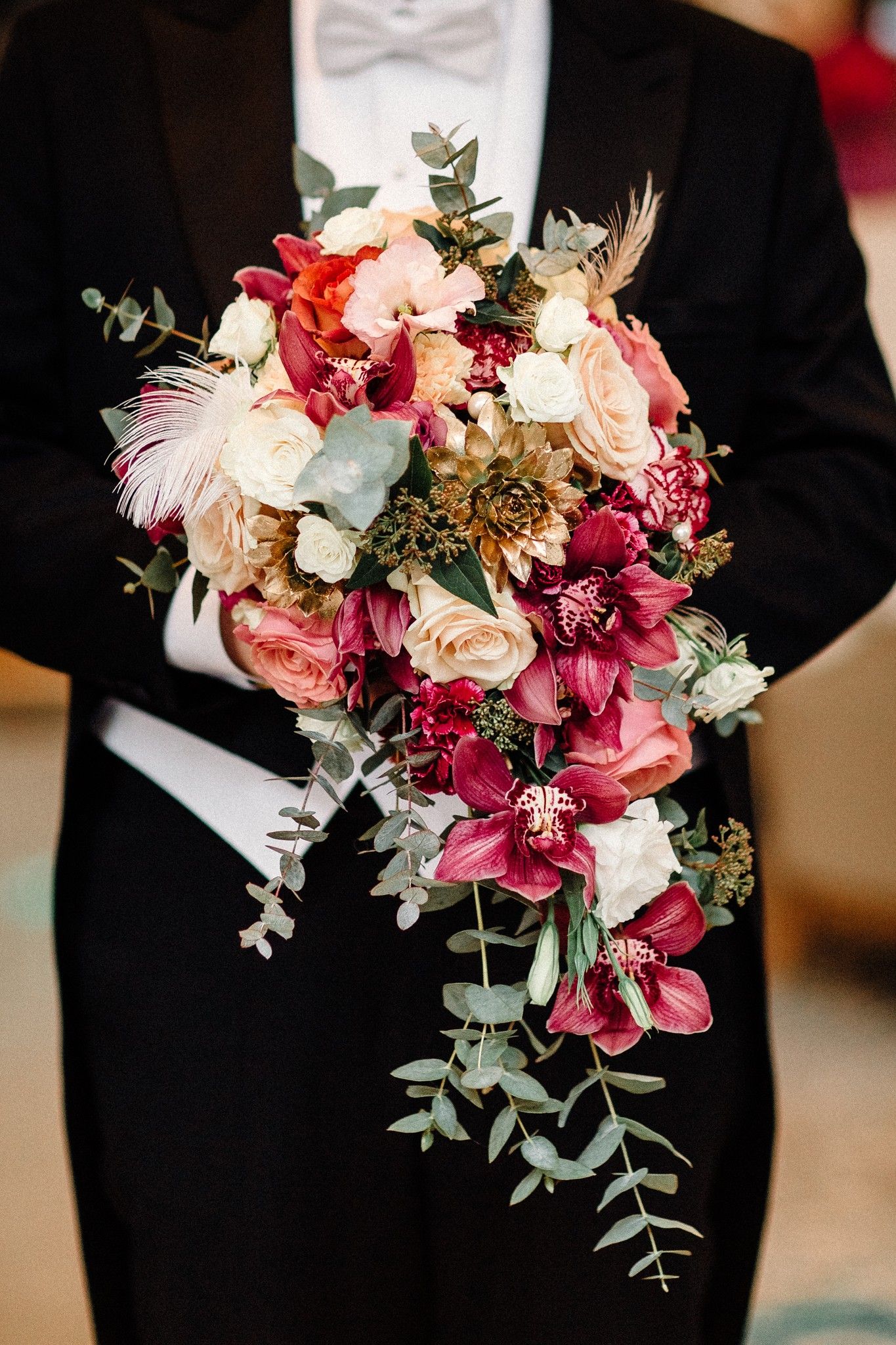 Cascade bridal bouquet with orchids