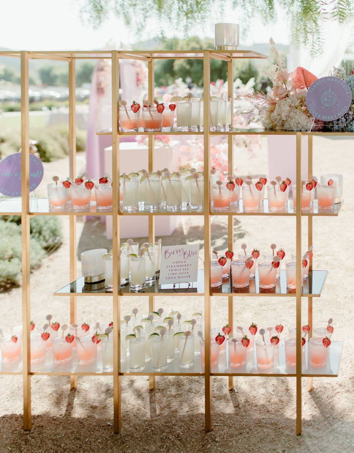 blush and sage green wedding drink wall