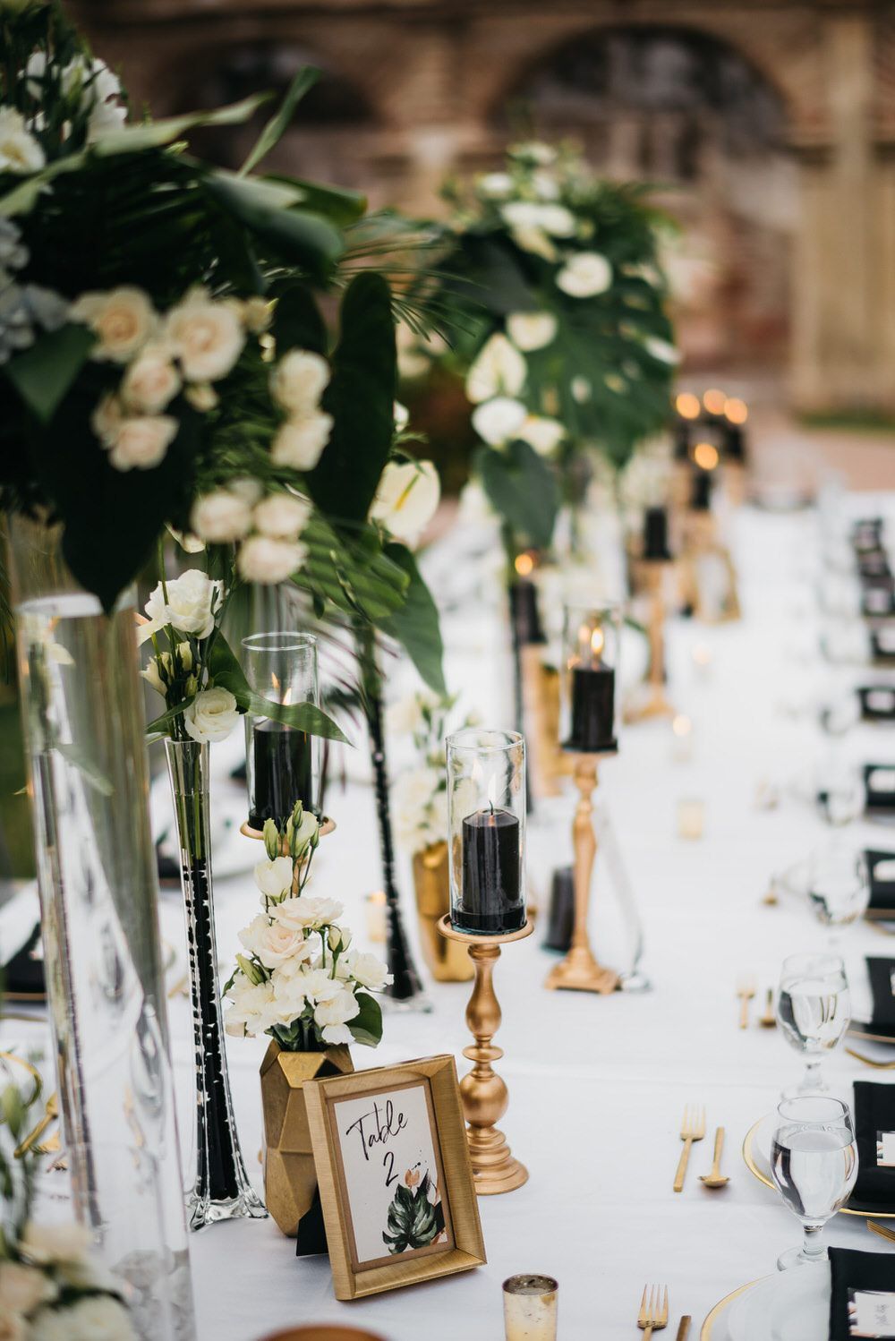 emerald green gold black wedding centerpiece