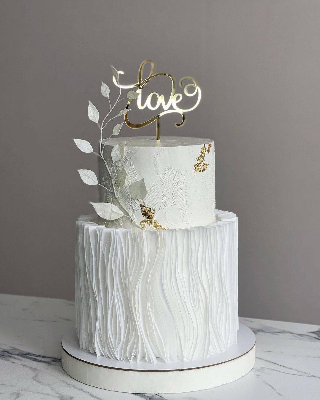 2 tier elegant wedding cake ruffled laser cut gold cake topper