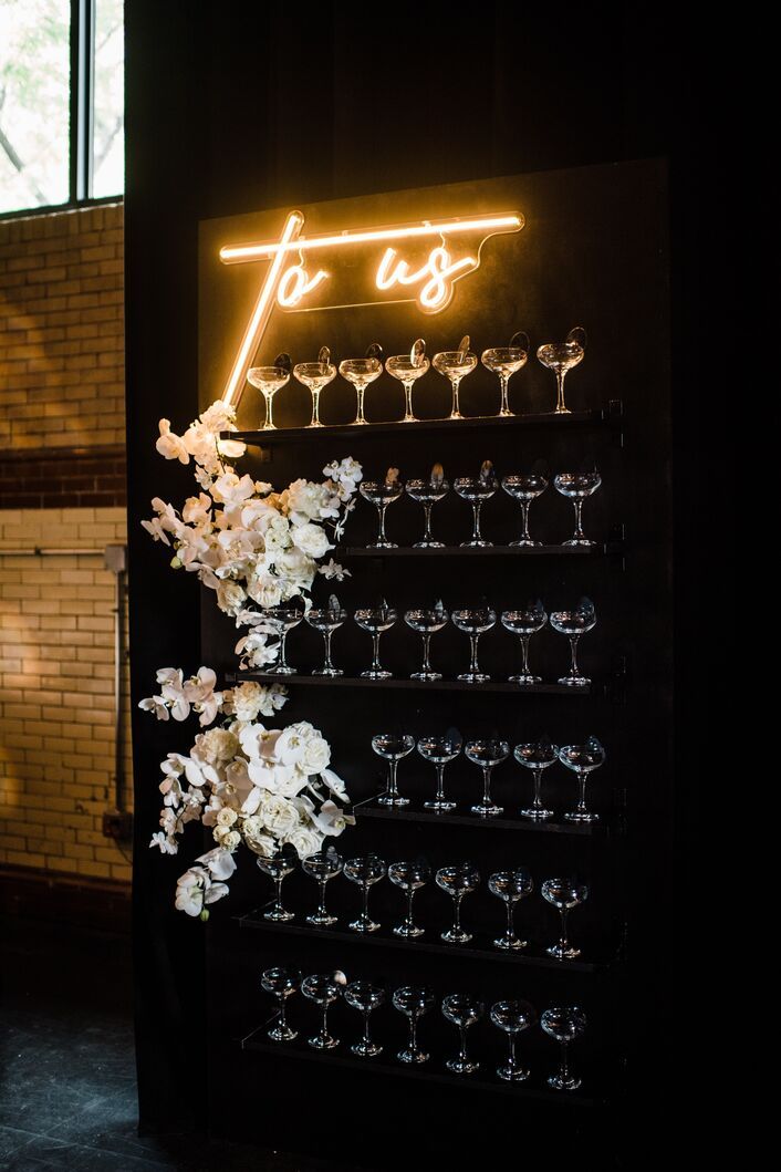Champagne Display with Flowers and Lighted Sign