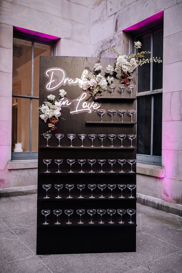 black champagne wall with neon sign