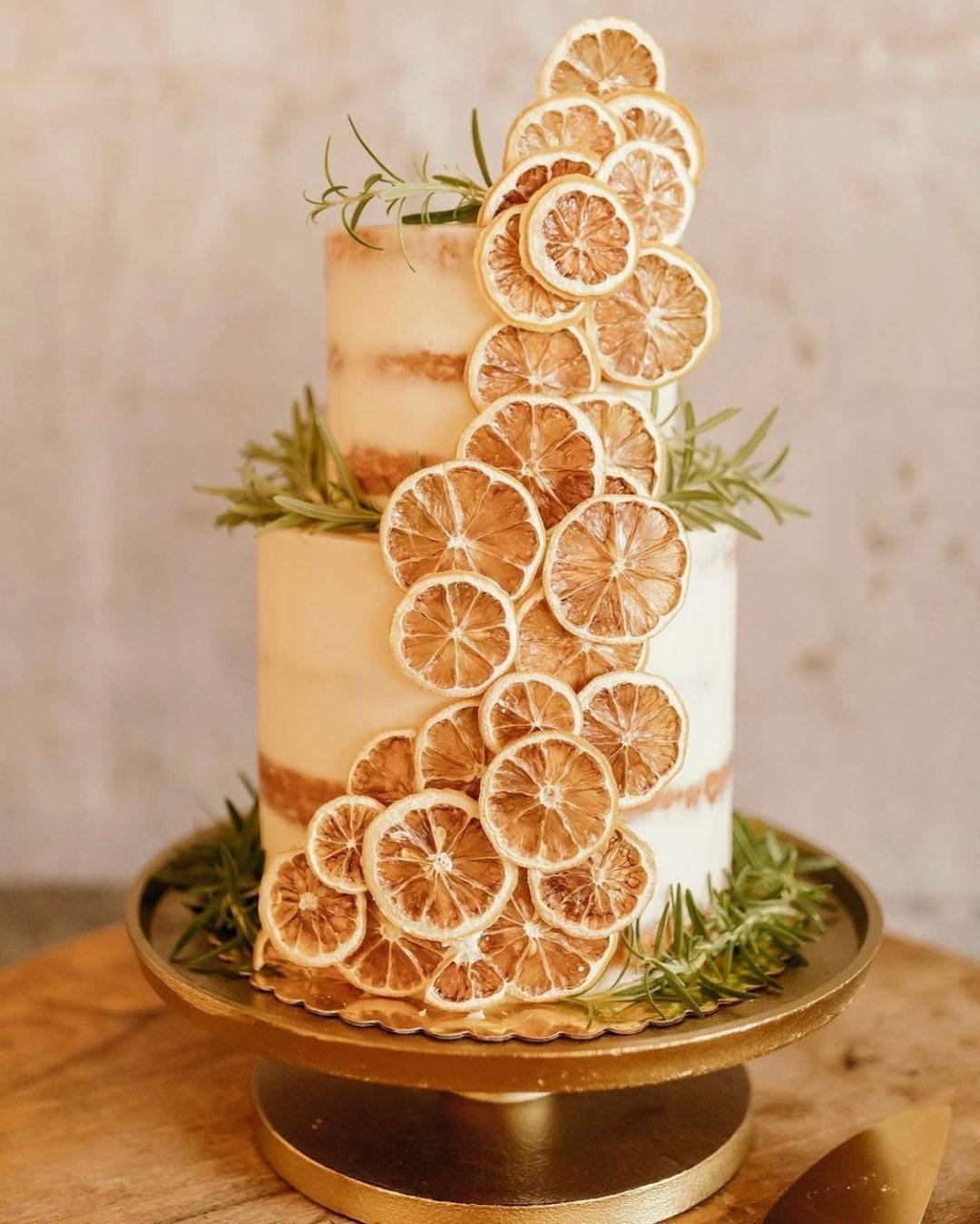 rustic naked wedding cake with dried lemon