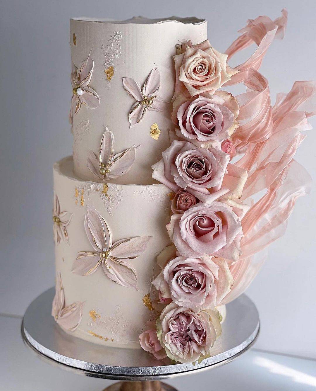 two tier wedding cake with dusty roses