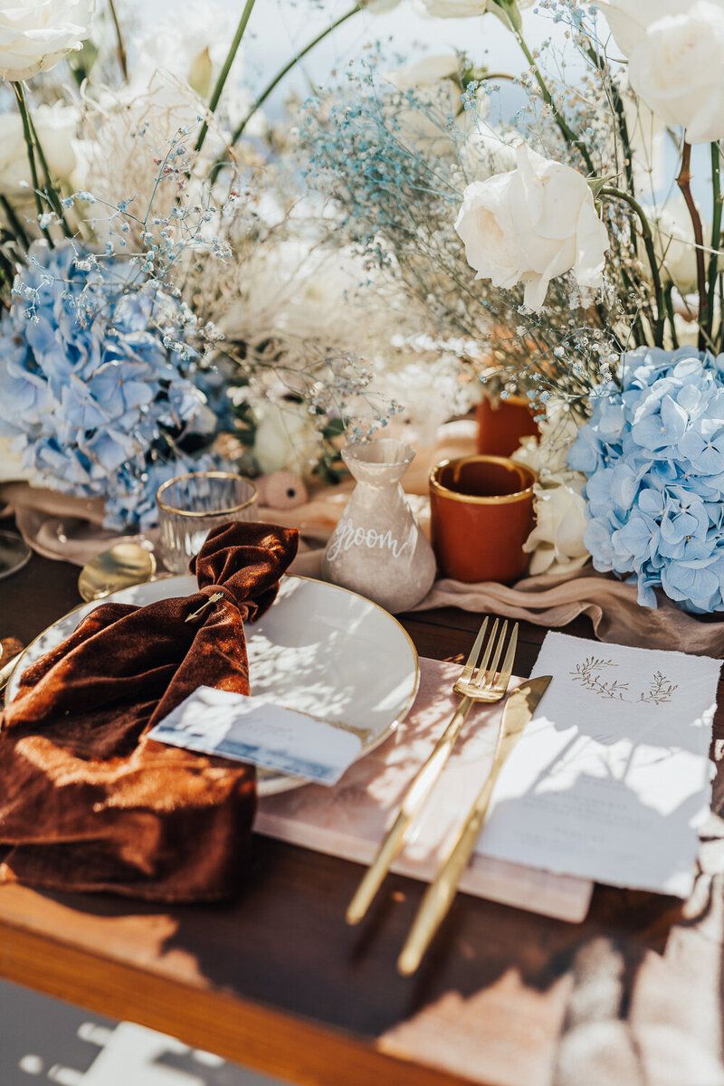 terracotta and light blue wedding centerpiece