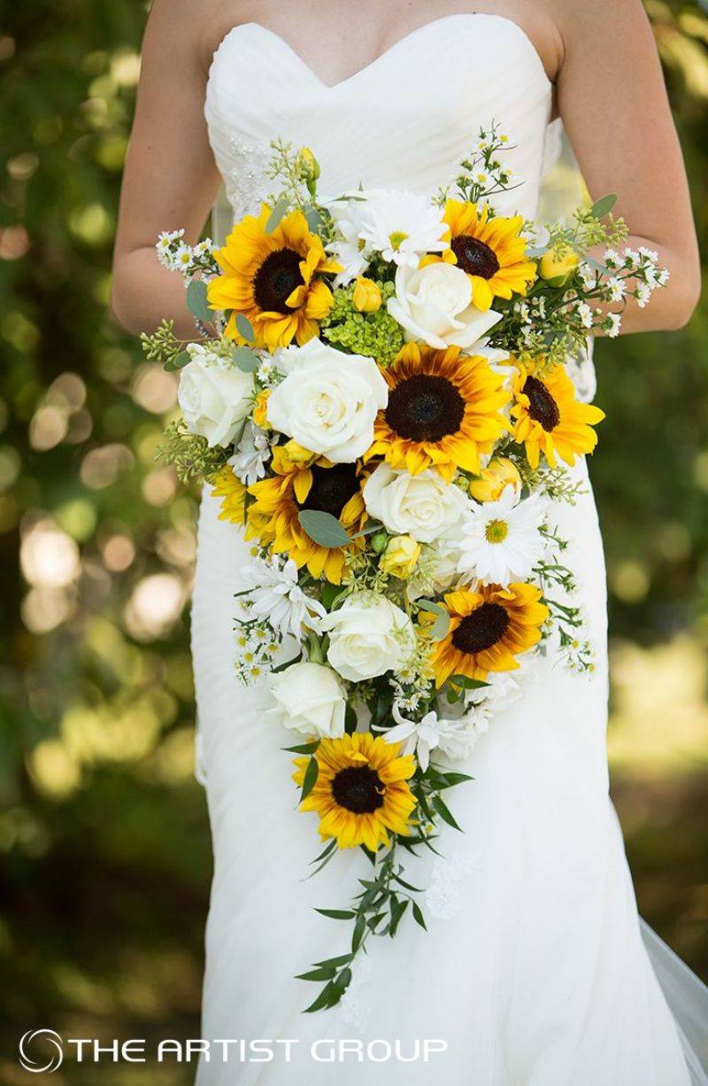Cascading sunflower wedding bouquet with white roses
