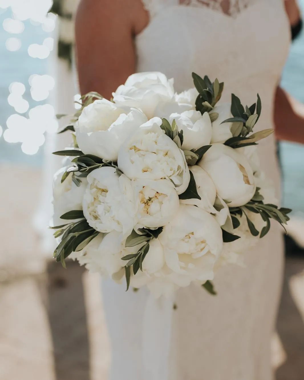 elegant simple white peony wedding bouquet via lo.lodesign