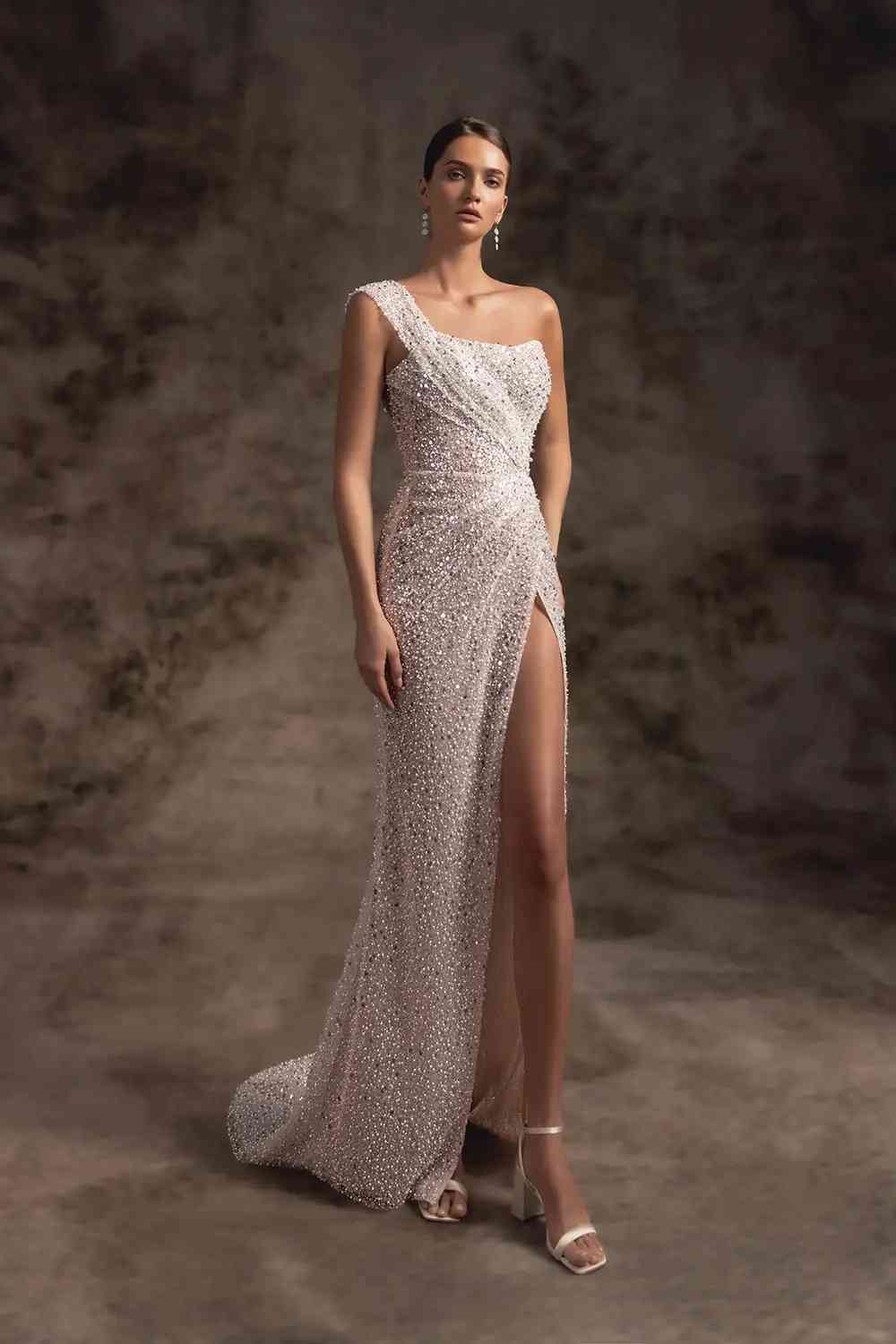 one shoulder pearls high slit wedding gown wonaconcept. verdi_min