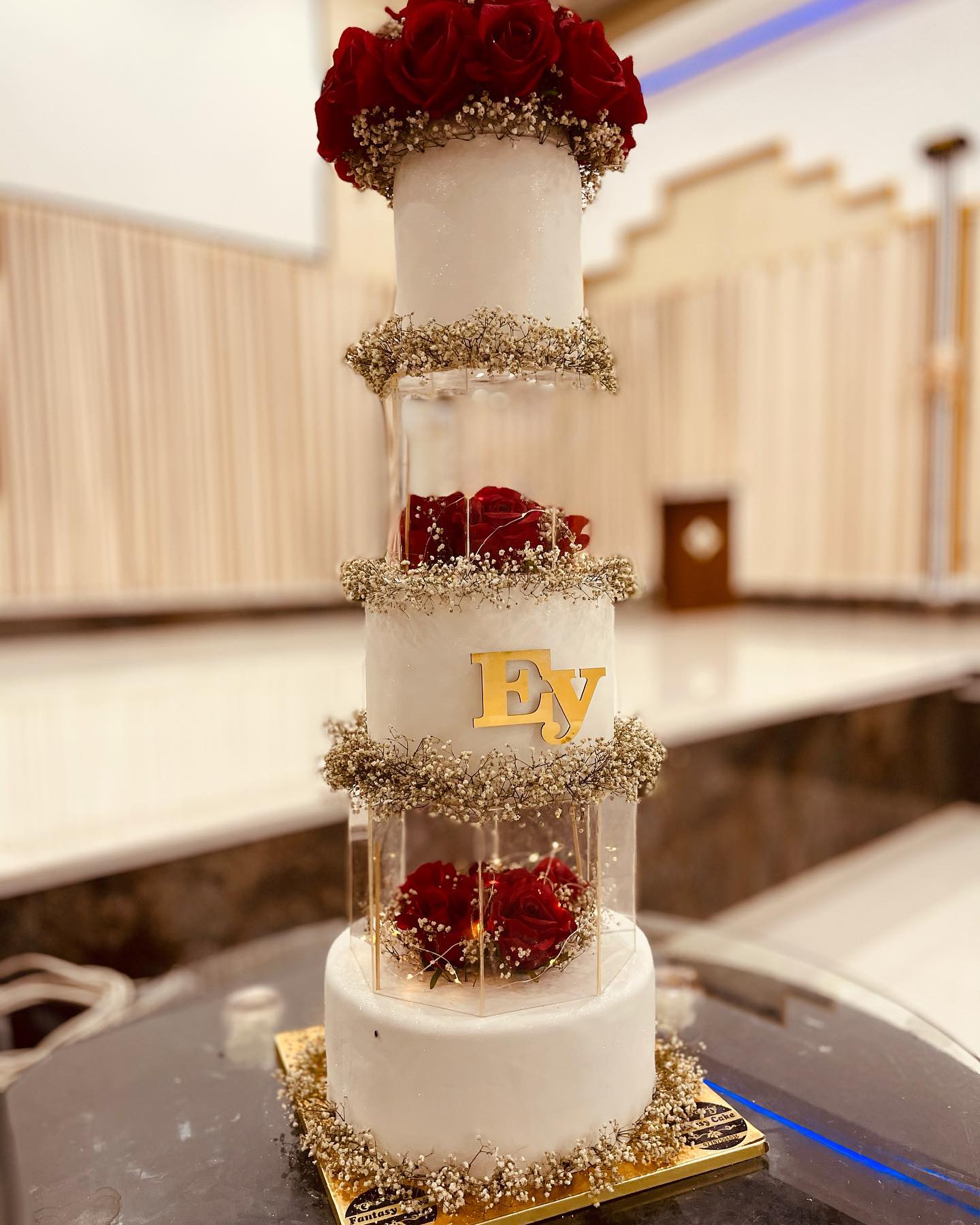 3 tier buttercream floating red roses wedding cake