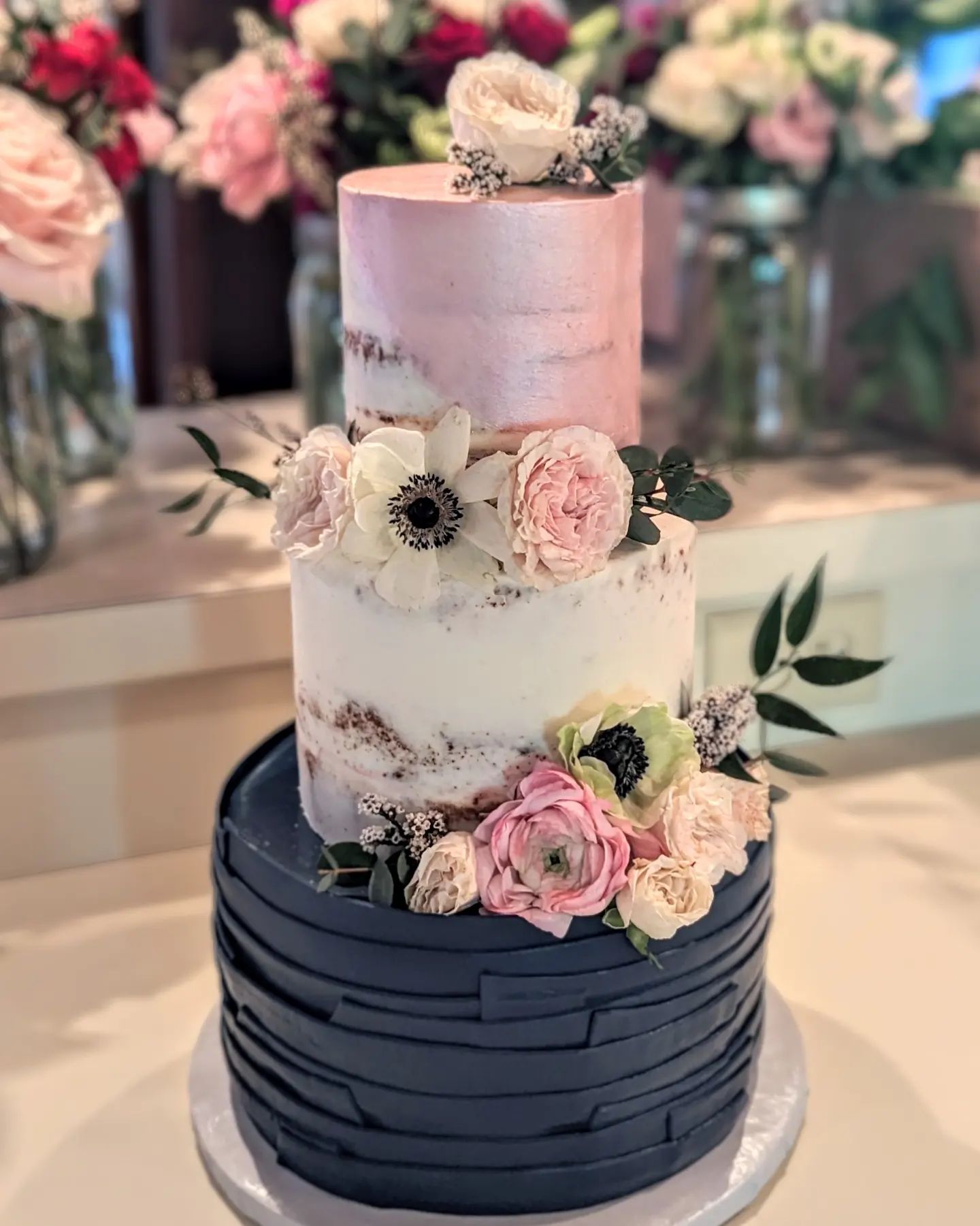 3 tier navy and blush wedding cake