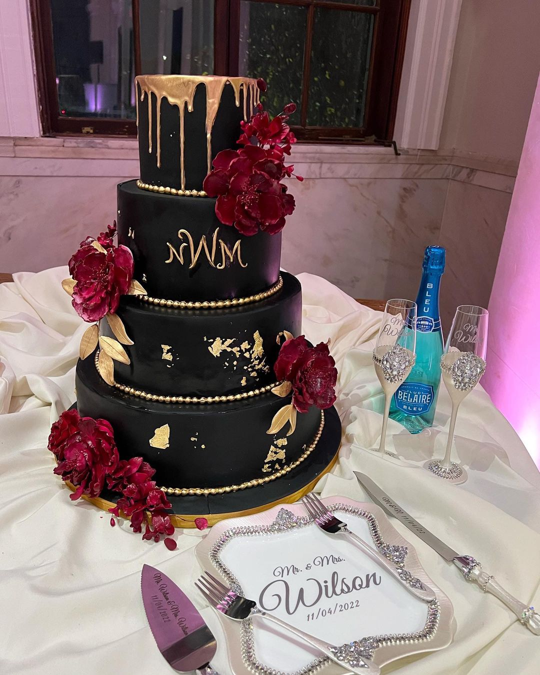 4 tier black gold and red wedding cake via cakesbylameeka