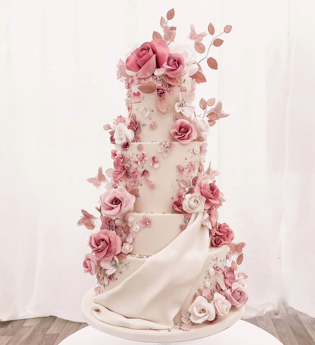 4 tier romantic wedding cake with pink sugar flowers via theprettycakecompany
