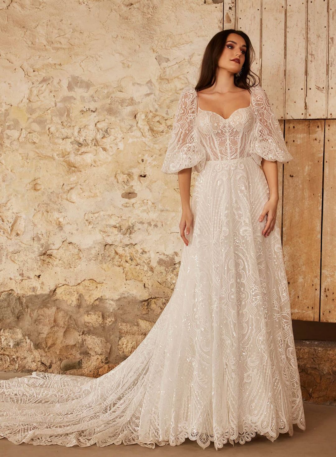 A-line backless sequined sweetheart lace wedding gown with optional long sleeves and spaghetti straps