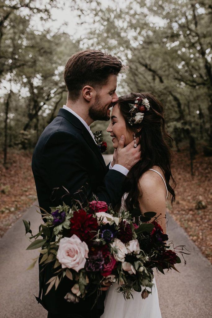 Moody fall burgundy dahlias and black flower bouquet