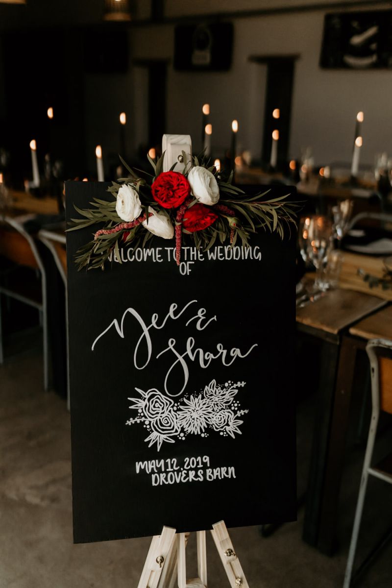 Rustic black wedidng sign with burgundy and white garden roses